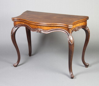 A 19th Century French mahogany card table of serpentine outline raised on carved cabriole supports 73cm h x 92cm w x 49cm d 