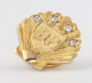 A 9ct yellow gold "BP" shell shaped diamond set pin 4.3 grams