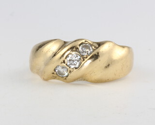 An 18ct yellow gold diamond set ring, size K, 6.4 grams