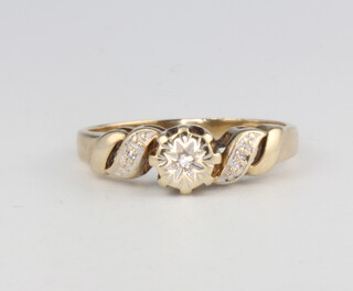 A 9ct yellow gold diamond ring, size K, 2.1 grams  