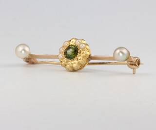A 9ct yellow gold peridot and seed pearl bar brooch