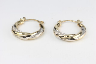 A pair of 9ct two colour gold hoop earrings 1.5 grams 