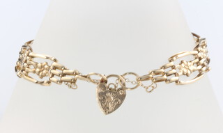 A 9ct yellow gold bracelet with heart padlock 18cm, 6.2 grams