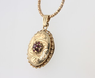 A 9ct yellow gold gem set locket and necklace 7.7 grams