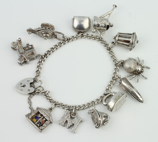 A silver charm bracelet 53 grams