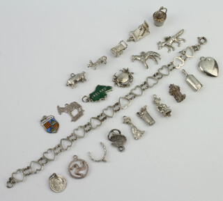 A collection of silver charms 44 grams