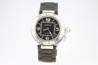 Cartier, a gentleman's steel cased Pasha de Cartier automatic wristwatch with calendar aperture, contained in a 41mm case, numbered 565869LX, having a matt black bracelet with spare links, original box and cased booklets, together with two manuals  
