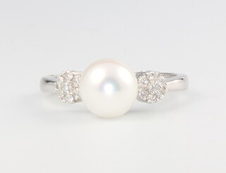 A 9ct white gold pearl and diamond ring, size M 1/2, 2.6 grams