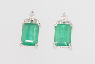 A pair of 14ct emerald and diamond ear studs, the emeralds approx 1.66ct, diamonds 0.20ct, 11mm, 2.3 grams 