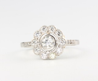 An Edwardian style 11 stone diamond cluster ring, approx. 0.75ct, size O 1/2, 4.6 grams