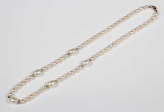 A string of cultured pearls with a 9ct yellow gold clasp 40cm 