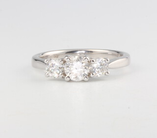 An 18ct white gold 3 stone diamond ring, approx. 0.98ct, size M, 3.4 grams