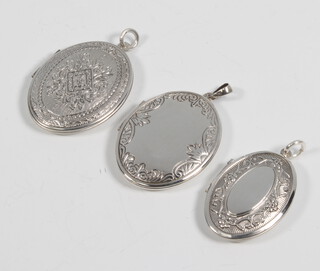 Three silver lockets