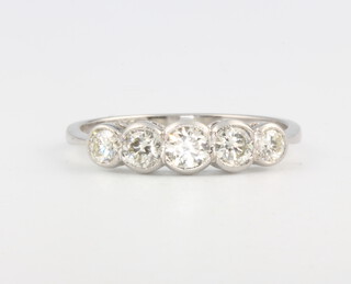 A platinum 5 stone graduated diamond ring approx. 0.7ct, 2.7 grams, size N