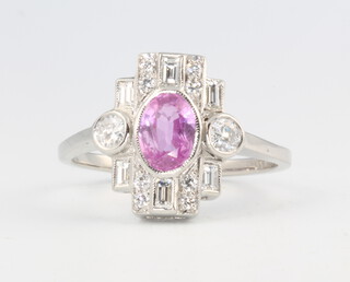 A platinum Edwardian style oval pink sapphire and diamond cocktail ring, size 0 1/2, 4.7 grams