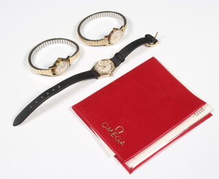 A lady's 9ct yellow gold Omega wristwatch on an expanding gilt bracelet, 2 other watches 
