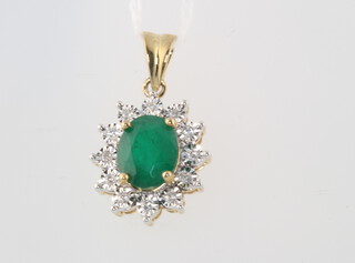 A 9ct yellow gold oval emerald and diamond pendant, the centre stone approx. 1.85ct, the brilliant cut diamonds 0.12ct, 23mm, 2.3 grams 
