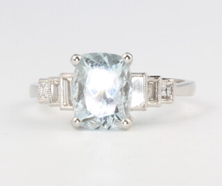 A platinum aquamarine and diamond ring, the emerald cut stone approx. 2.1ct flanked by 3 diamonds, the centre stone approx. 2.1ct, the diamonds approx. 0.3ct, size M 1/2, 4.3 grams 