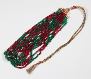 A necklace of ruby and emerald beads 48cm 