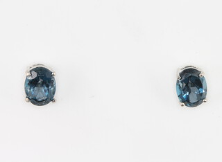 A pair of silver London blue topaz ear studs 