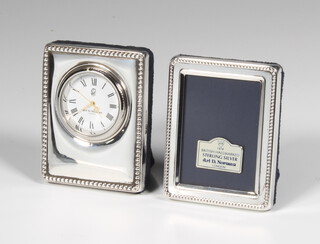 A silver mounted rectangular photograph frame 6cm, a ditto timepiece 6cm 