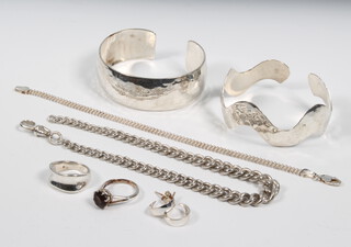 A silver bangle and minor silver jewellery, 100 grams