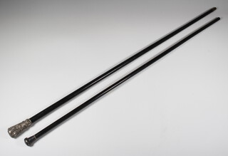 An Edwardian ebonised walking cane with silver knop, a plated ditto 