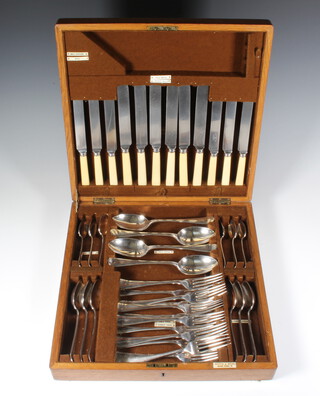 A Mappin & Webb oak canteen containing a canteen of plated cutlery for 6
