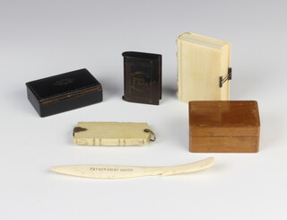 A Victorian ivory purse in the form of a book, an aide memoire, 2 trinket boxes, a vesta and orange peeler 