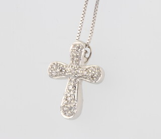A 9ct white gold diamond set cross pendant on a 40cm chain, 2 grams
