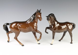 A Beswick figure "Spirit of the Wind" H2688, brown gloss modelled by Graham Tonge 20.3cm, together with a ditto horse, head tucked up, leg up H1549 brown gloss, modelled by Pal Zalmen 19.1cm  