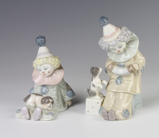 A Lladro figure of a seated clown playing a concertina 15cm, ditto of a seated clown with a dog on his lap 10cm 