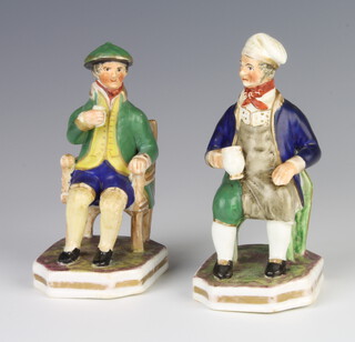 Two Staffordshire figures of seated gentleman holding mugs, raised on octagonal bases 12cm 