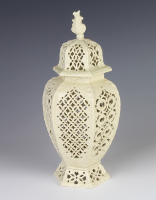 A 19th Century creamware reticulated hexagonal vase and cover with geometric decoration 24cm 