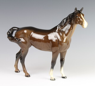 A Beswick figure of a swish tail horse H1182 gloss, modelled by Arthur Greddington 22.2cm 
