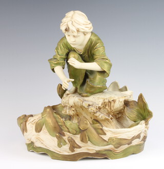 A Royal Dux centrepiece in the form of a boy crouching above a fish pond no.576 30cm 