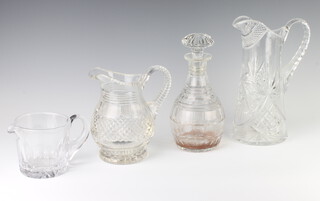 A cut glass baluster water jug 18cm, a squat jug 11cm, a ewer 27cm and a mallet shaped decanter with mushroom stopper (decanter lip and stopper chipped) 24cm 