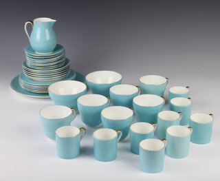 A Wedgwood blue and gilt tea and coffee service comprising 9 coffee cans, 9 saucers, 6 tea cups, 6 saucers, 6 small plates, 1 sandwich plate, cream jug, sugar bowl, slop bowl 