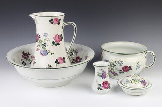 A Nelson Ware Art Nouveau washstand set comprising water jug, wash bowl, vase, soap dish and chamber pot decorated with flowers 