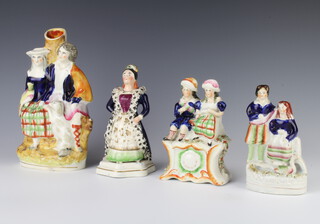 A Staffordshire spill vase in the form of a couple with a spaniel and bird 21cm (chip to base), a ditto of a seated couple above a clock 14cm (firing crack), a standing lady with a fur trimmed coat 17cm and a lady and gentleman standing before a swan 13cm (chipped) 