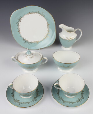 A Royal Doulton Melrose pattern tea service comprising 12 tea cups, 12 saucers, milk jug, lidded sugar bowl, slop bowl, 12 small plates, 2 sandwich plates (all seconds) 