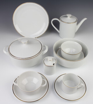 An Arzberg coffee and dinner service with gilt rims comprising coffee pot, 7 coffee cups, 8 saucers, 7 two handled cups, 7 saucers, tureen and cover, bowl, sauce boat, 10 small plates, 7 medium plates, 8 dinner plates, 8 dessert bowls, sugar bowl and lid 