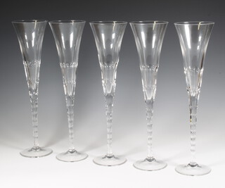 A set of 5 Renwick and Clarke champagne flutes 37cm 