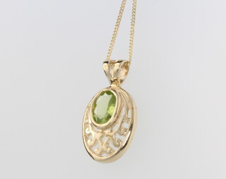 A 9ct yellow gold oval peridot pendant on a ditto 46cm chain, 2.4 grams