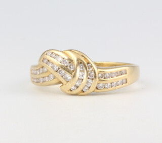 An 18ct yellow gold diamond crossover ring, 4.8 grams, size Q