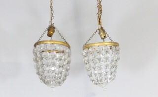 A pair of circular bag shaped light fittings hung lozenges 19cm x 15cm 
