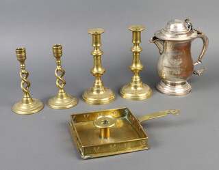 An 18th/19th Century square brass chamber stick 4cm x 15cm x 15cm, pair of 19th Century brass candlesticks with ejectors 20cm x 9cm, a pair of 19th Century brass spiral turned candlesticks 17cm x 9cm and a 17th Century style silver plated jug with hinged lid 20cm x 10cm (plate is warn and hinge is f) 
