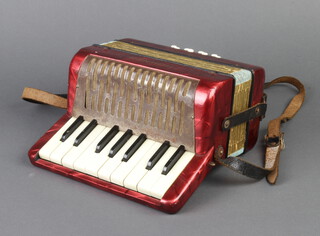 A Hohner accordion with 8 buttons 