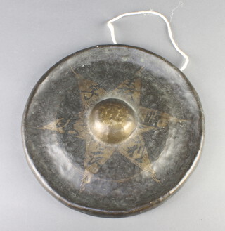 An Eastern circular metal gong 29cm diam. 