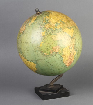 A Philips 9" terrestrial globe raised on a square black Bakelite base 